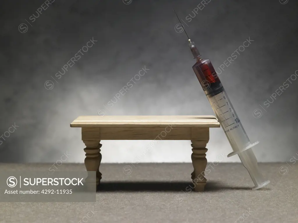 Syringe and table still life