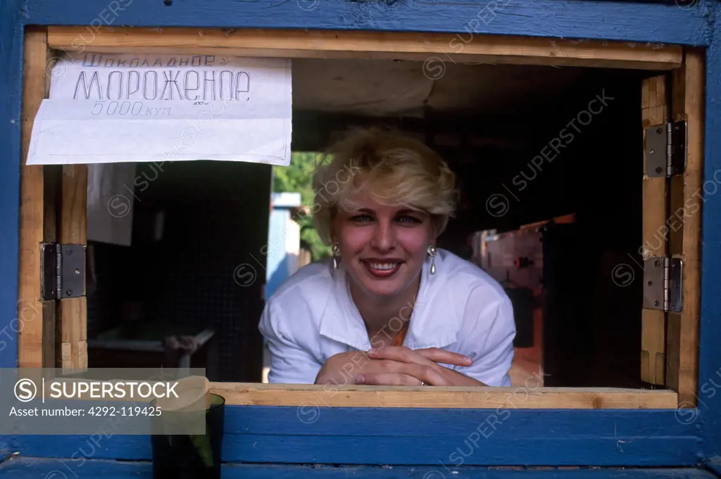 Ukraine, woman in icecream parlor