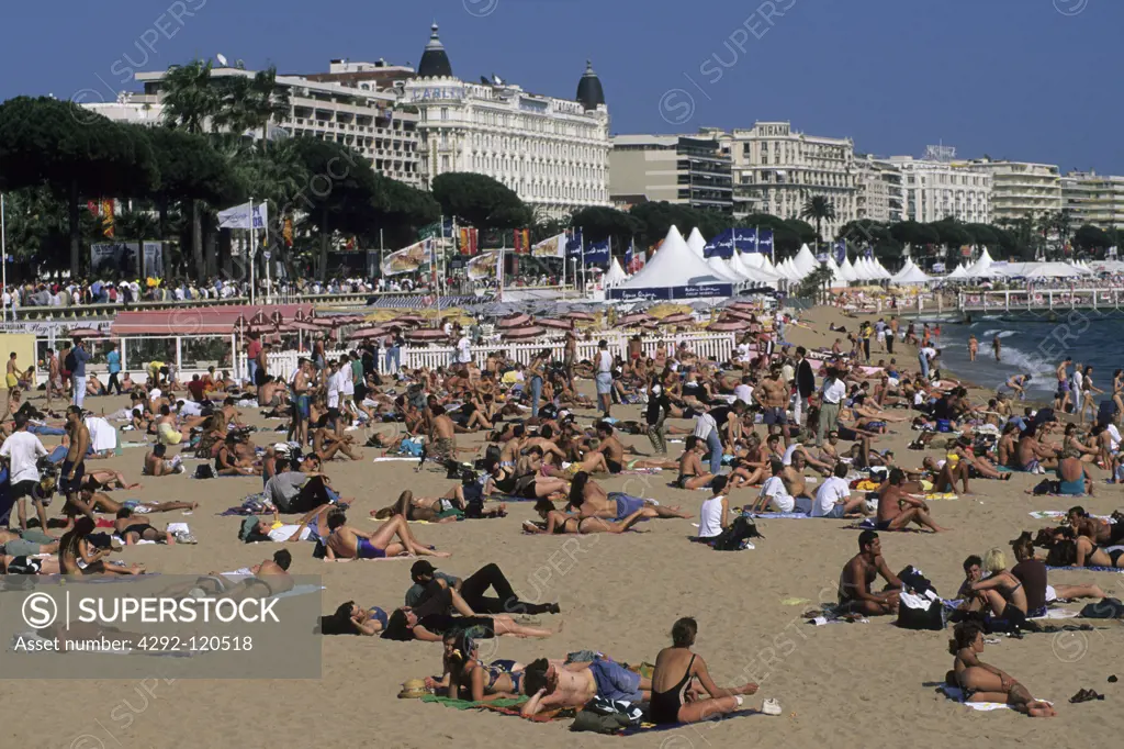 France, Provence, Cote d'Azur, Cannes, hotel and crowded beach with La Croisette