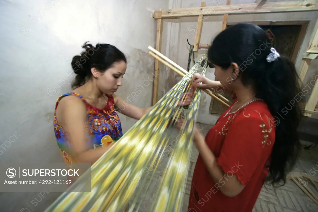 Uzbekistan, Bukhara, Women Weaving.