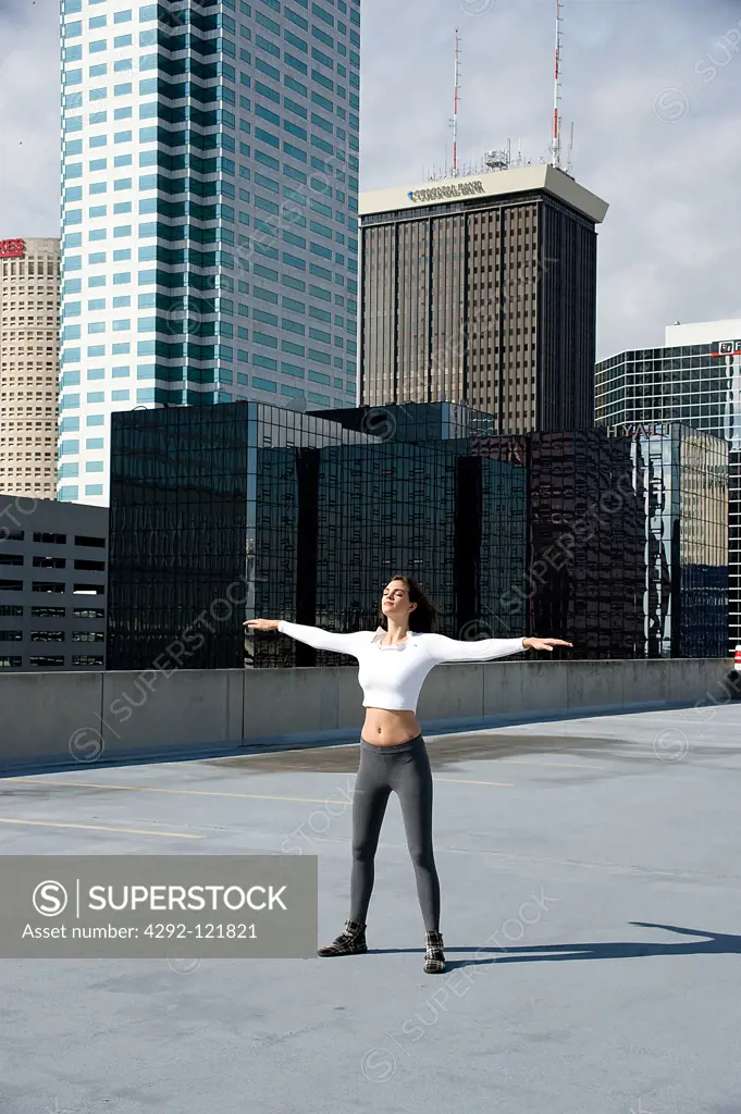 Woman doing gymnastics outdoors