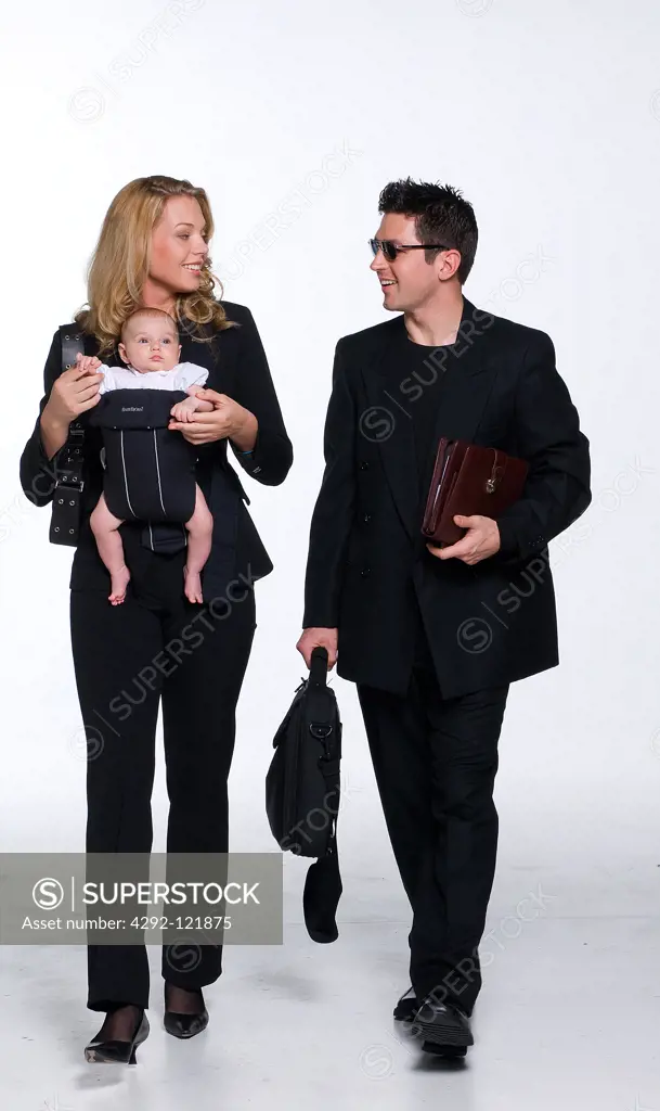 Businesswoman with her baby and male assistant