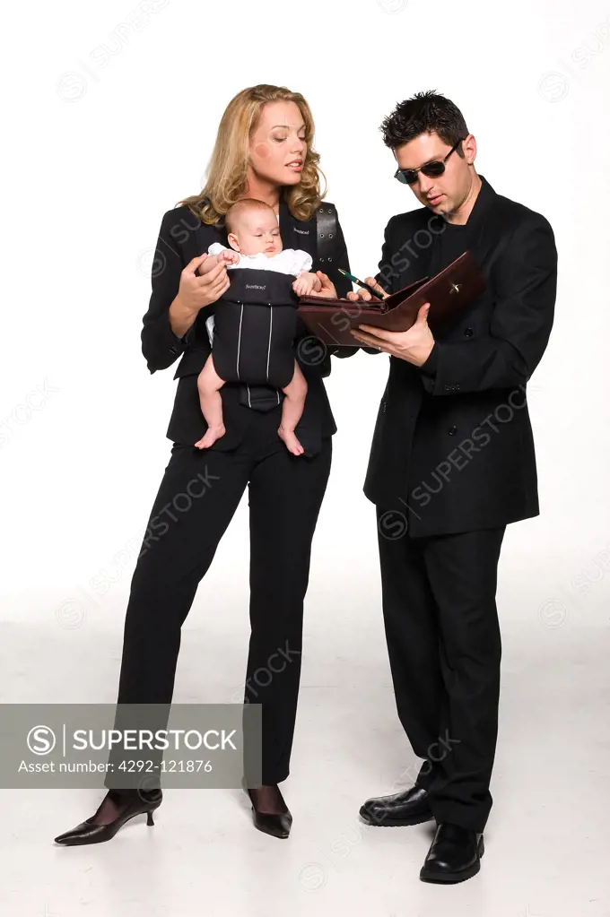 Businesswoman with her baby and male assistant