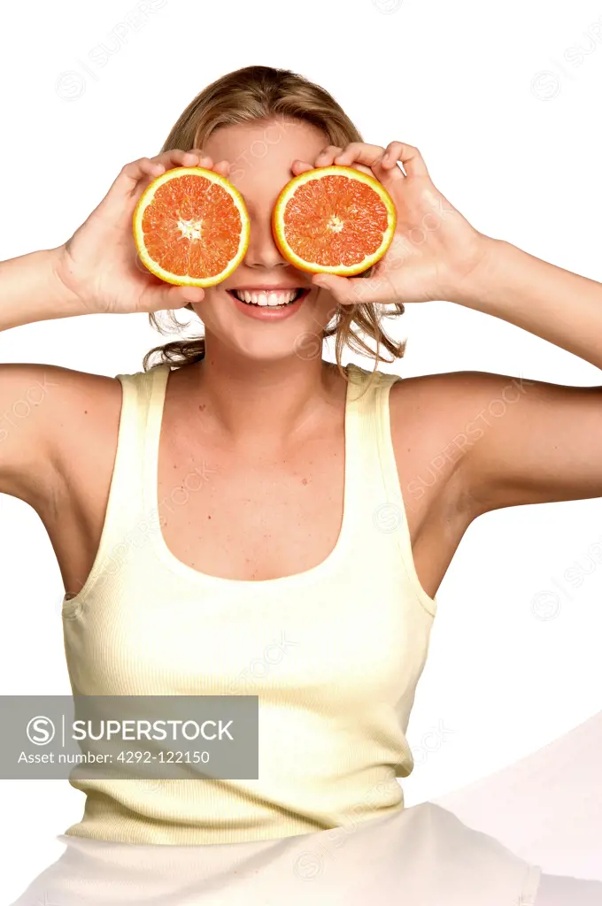 Young woman with orange slices