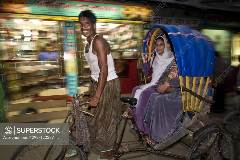 Bangladesh, Bogra, rickshaw in street at night