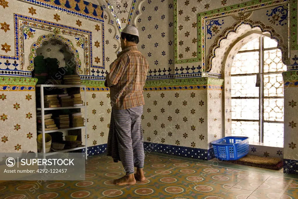 Bangladesh, Dhaka, man paying in mosque