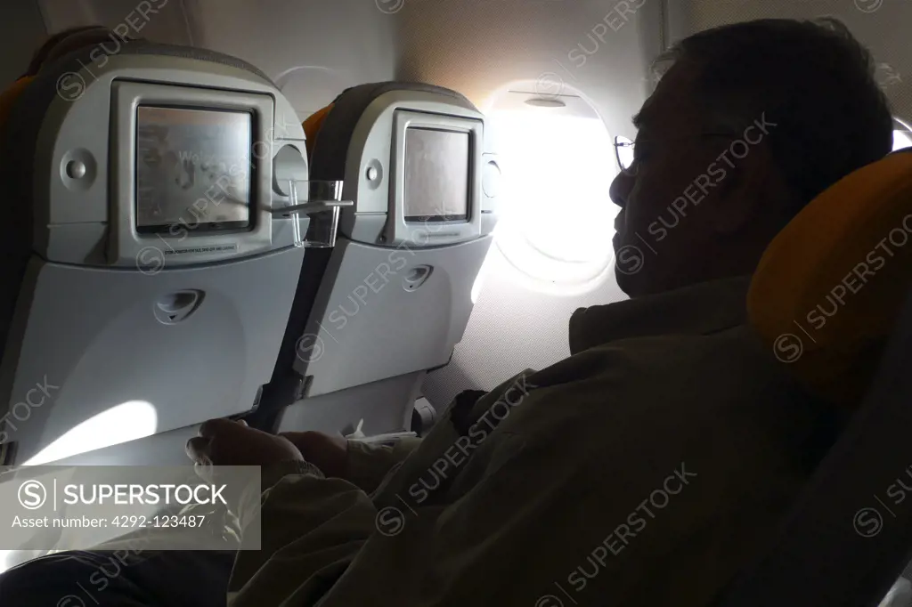 Man in airplane during flight