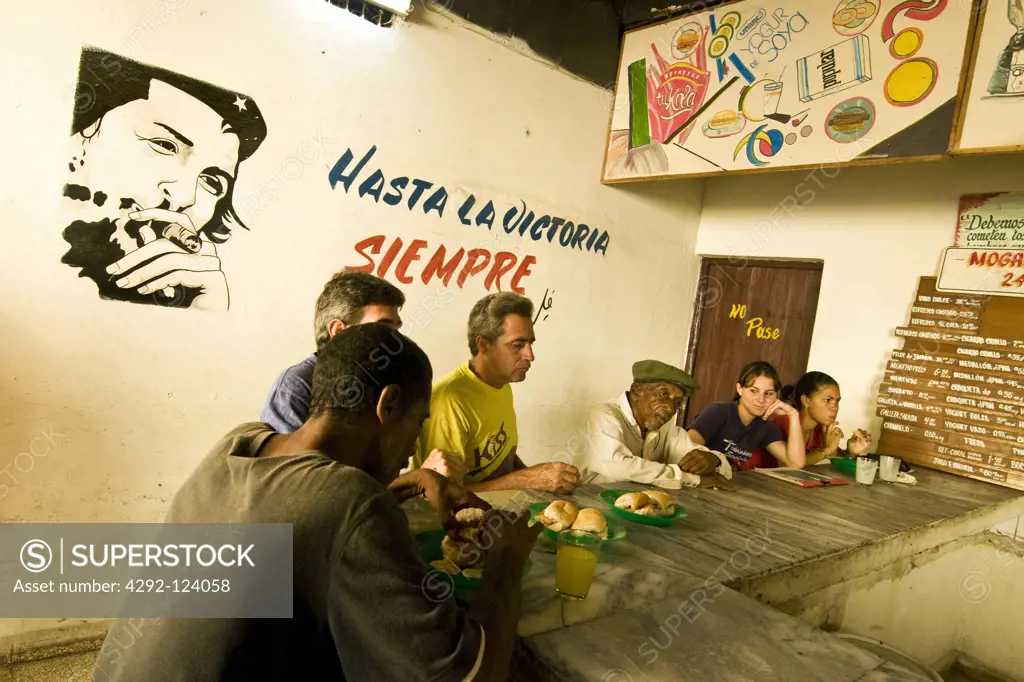 Cuba, Camaguey, people sitting at bar counter