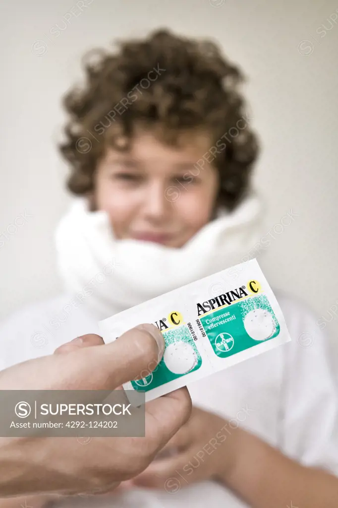 Boy receiving aspirin