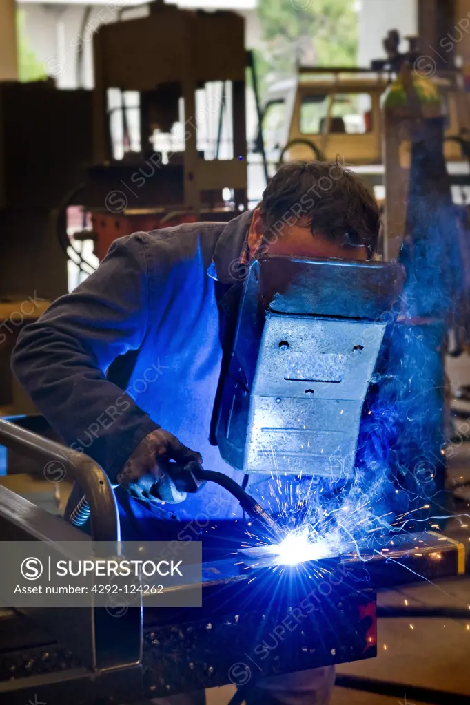 Metal-worker grinding