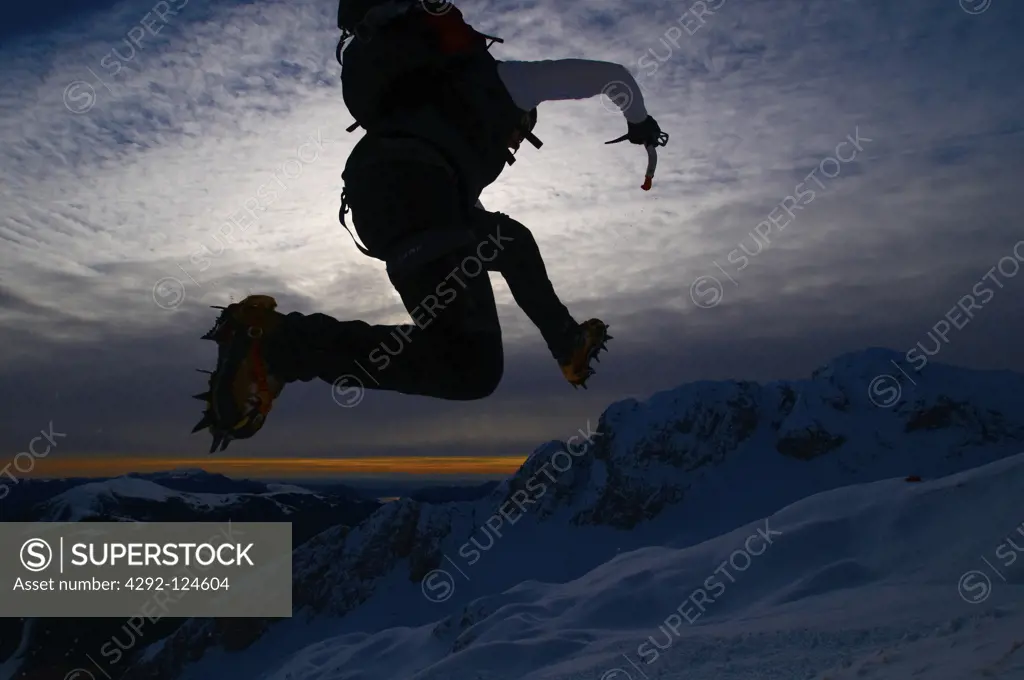 Italy, Alpi Oribiche, Climber jumping