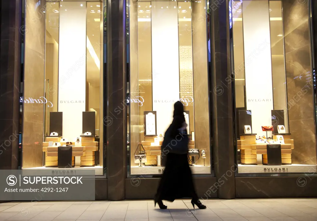 United Arab Emirates, Dubai, Arab Woman in a Hijab Walking on a City Street
