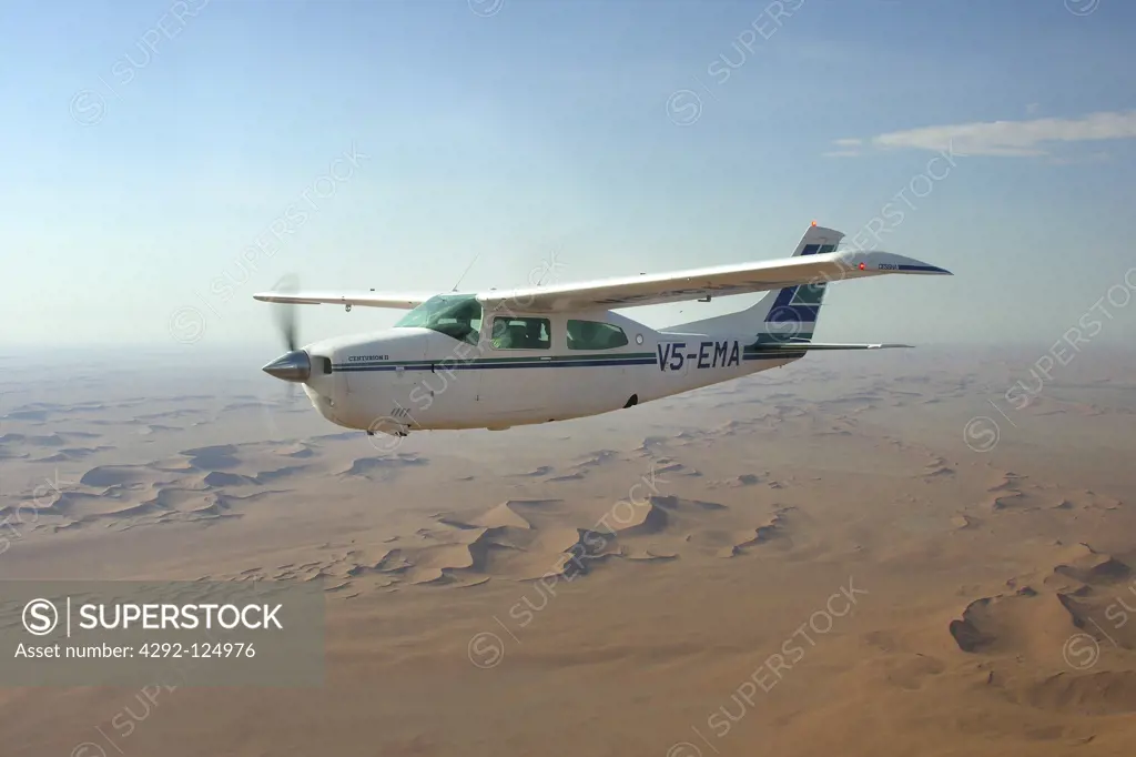 Africa, Namibia, aerial view of the desert and Cessna 210 airplane