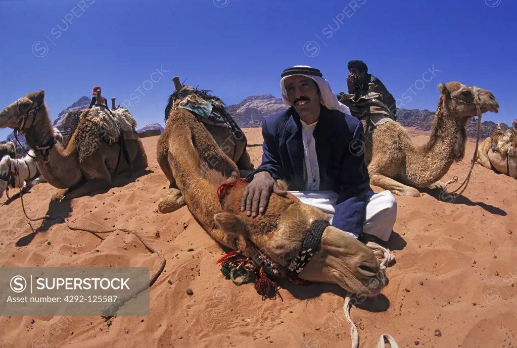 Jordan, bedouins with camels in the Wadi Rum desert