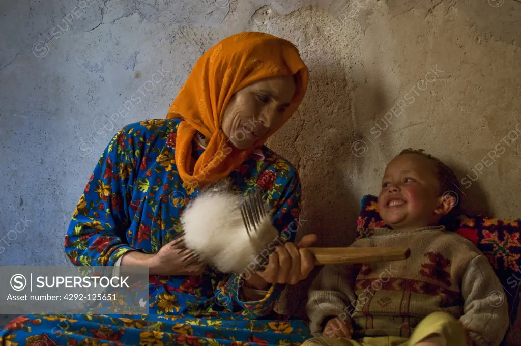 Morocco, Ait Bougmez. Woman with child