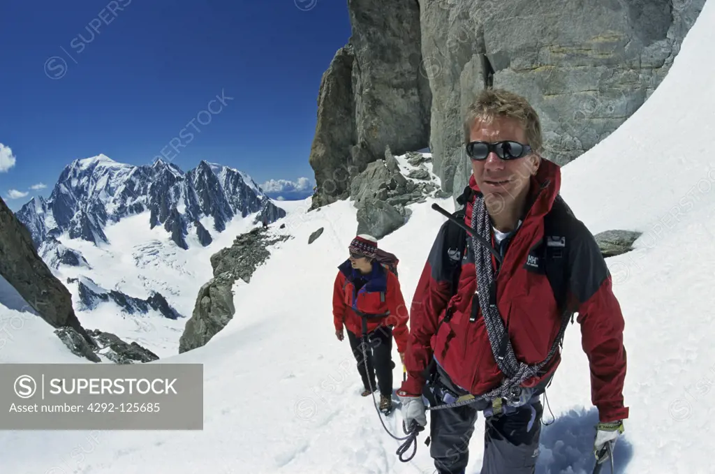 Italy, Aosta Valley, Mont blanc chain. Alpine guide climbing Dente del Gigante