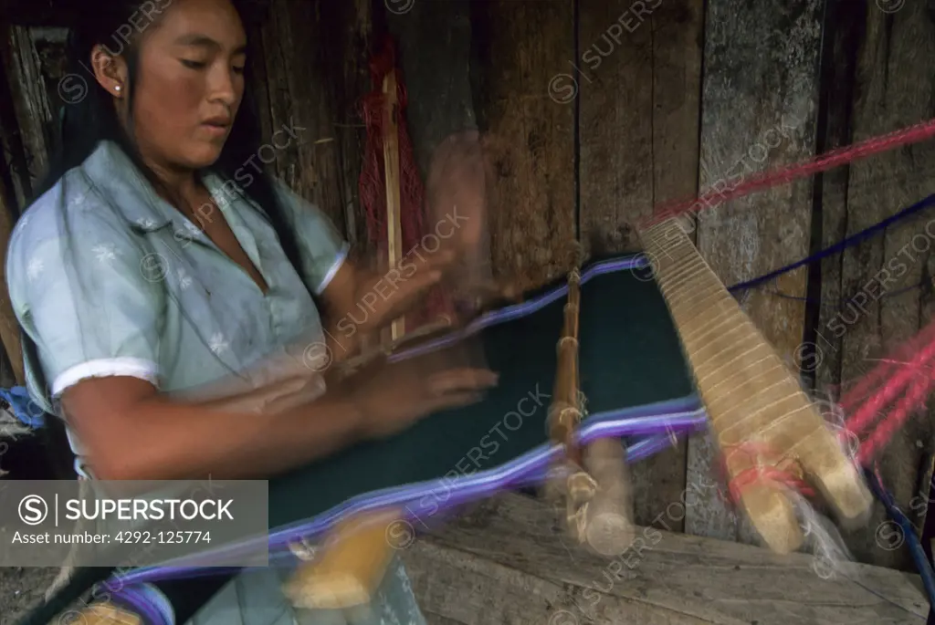 Peru, Piura, Huancabamba. Weaver working