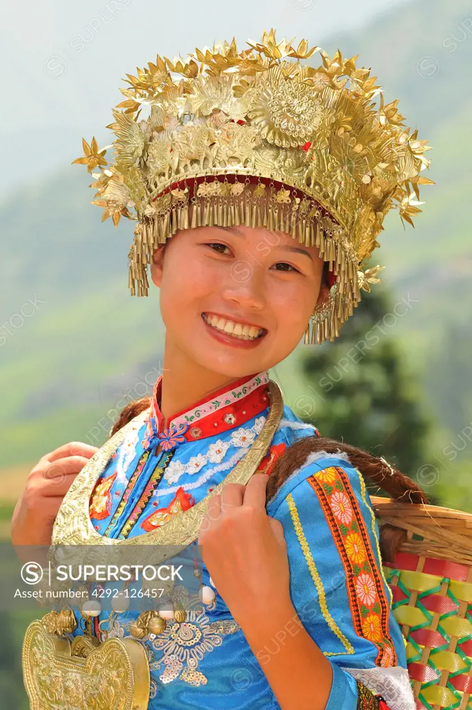 China, Guangxi Province, Guilin, girl with traditional dress at Longsheng terraced ricefields