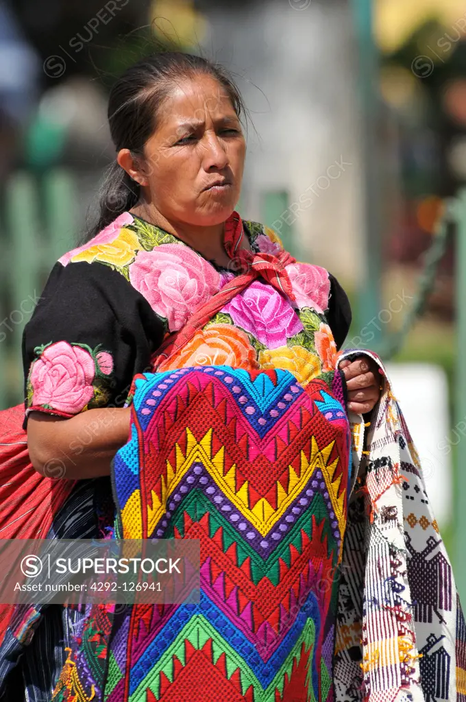 Guatemala, woman selling handicrafts at Antigua's street