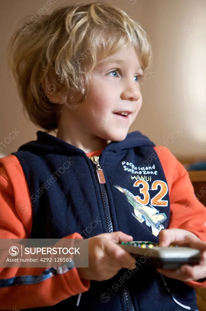 Boy holding a remote control