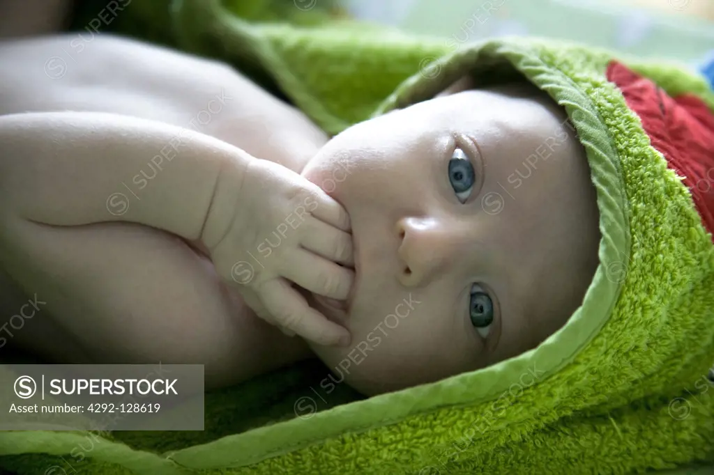 Portrait of baby girl wearing bathrobe