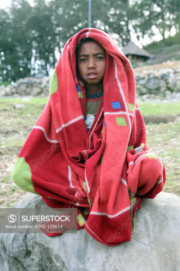 A boy in a mountain village in the scenery with poor bites of the mountain region to the south of Dili of the capital of the east Timor with Tutuala, the east Timor.