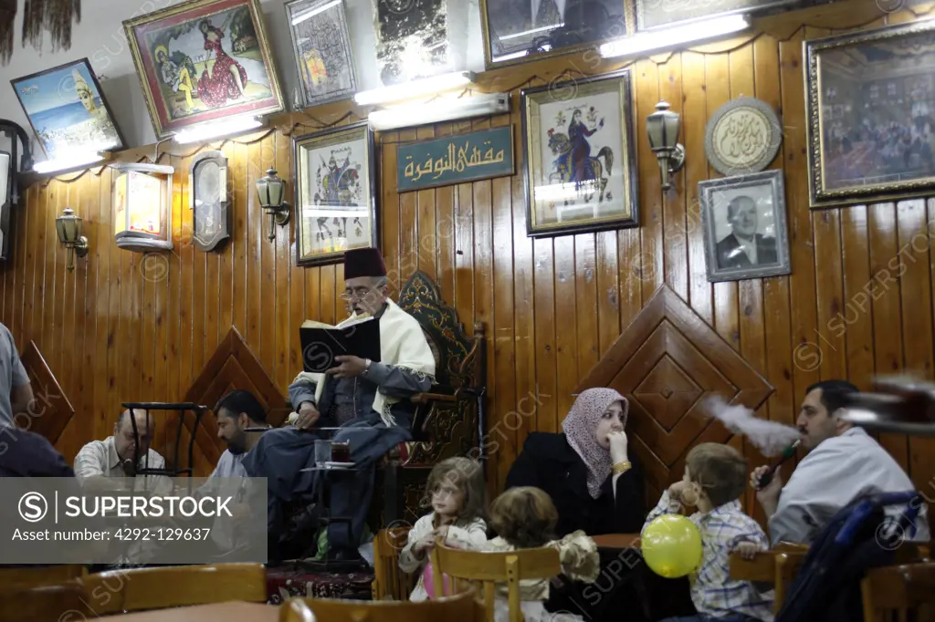 The story narrator Abu Shady in the cafe in Nafura in the Souq or market in the Old Town and capital of Syria and city of Damascus in Übersicht, Syria