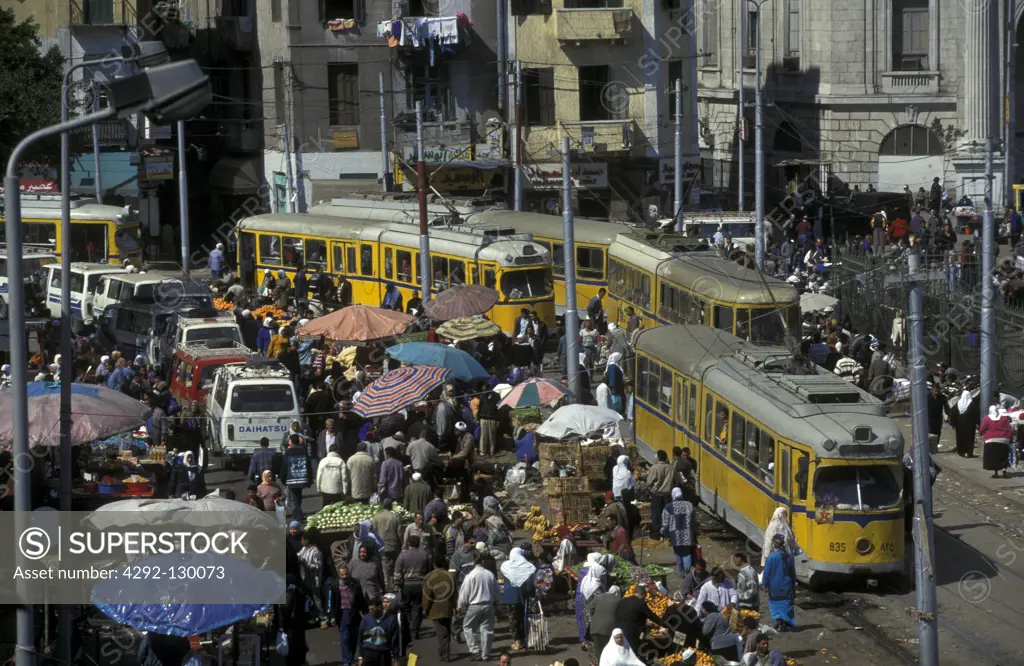 The centre with the Souq with many people and the traditional tram of Alexandria at the Mediterranean Sea in Egypt.