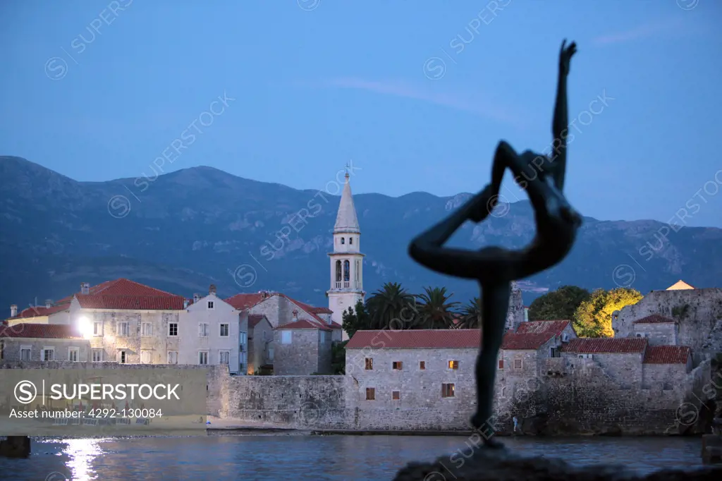 The Old Town with the church Sv. Ivan Krstitelji of Adriatic city of Budva with many new Appatementhausern in Montenegro in the Balkans at the Mediterranean Sea in Europe.