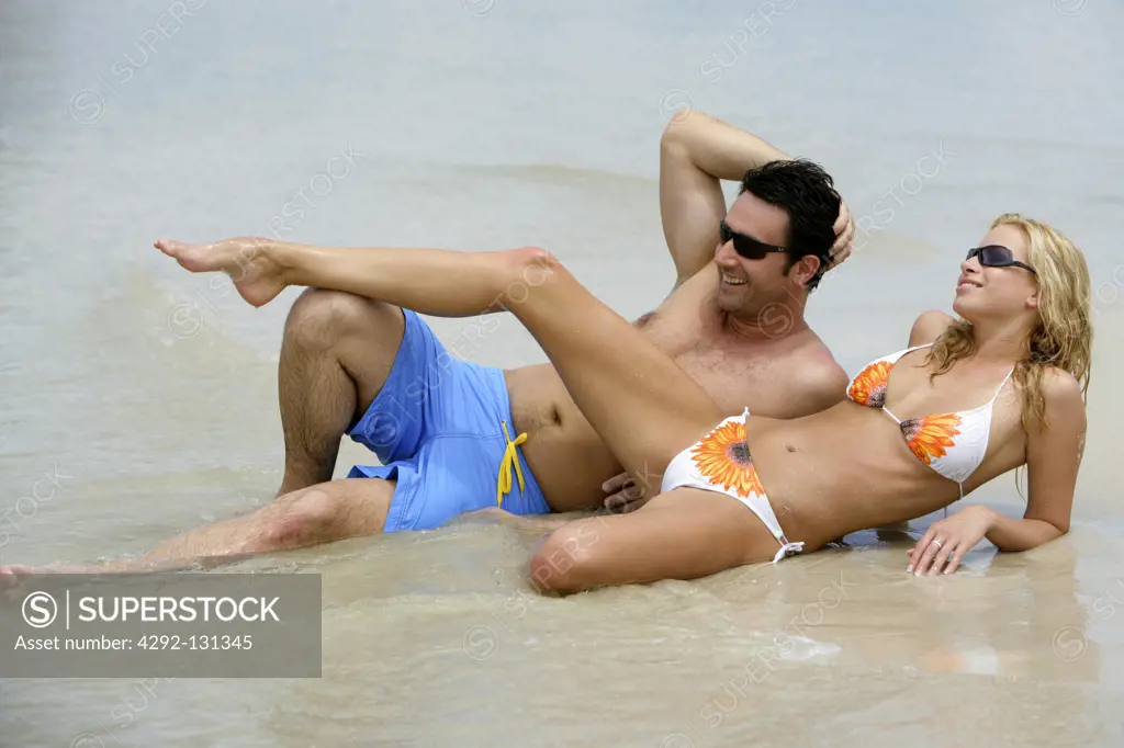 couple relax on tropical beach in