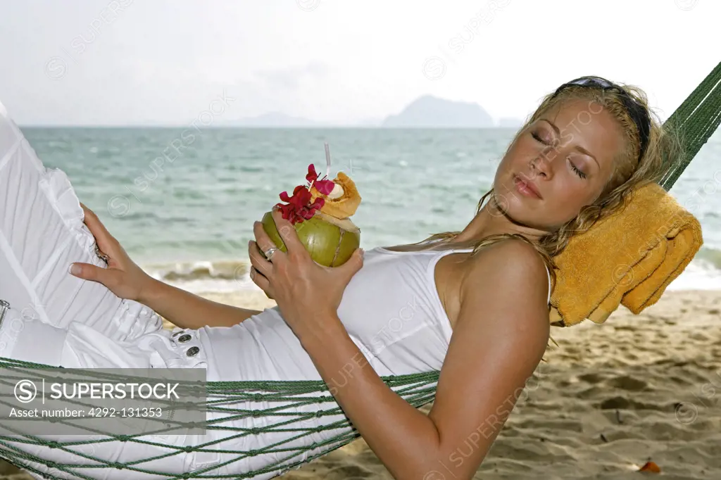 Young woman relax in Hammock at yao yai island resort