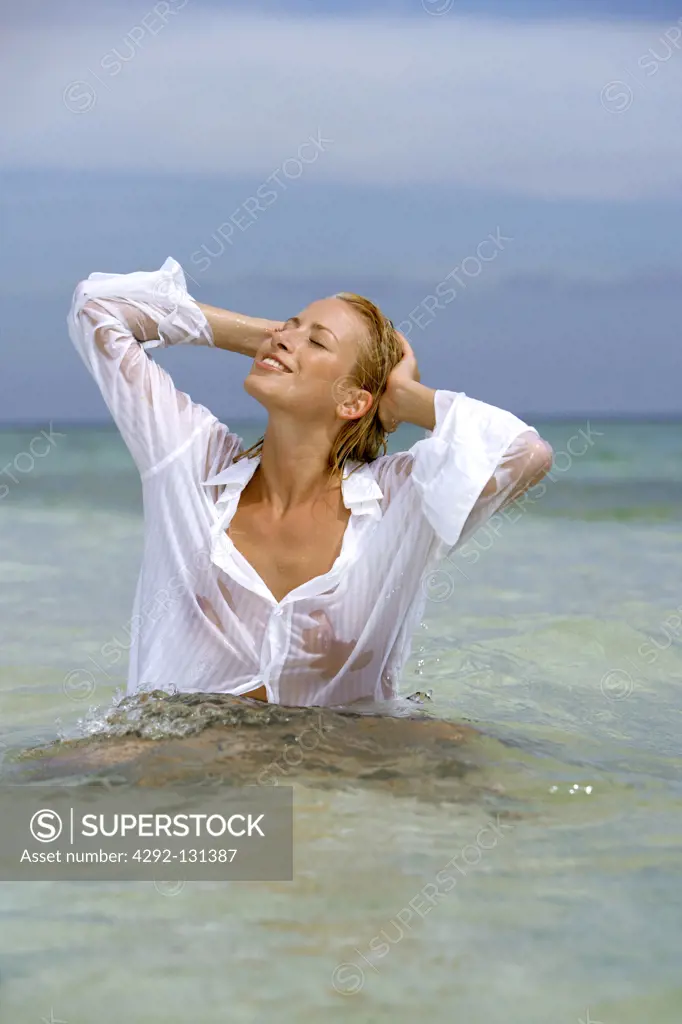 sexy young blond woman enjoying holiday in portrait