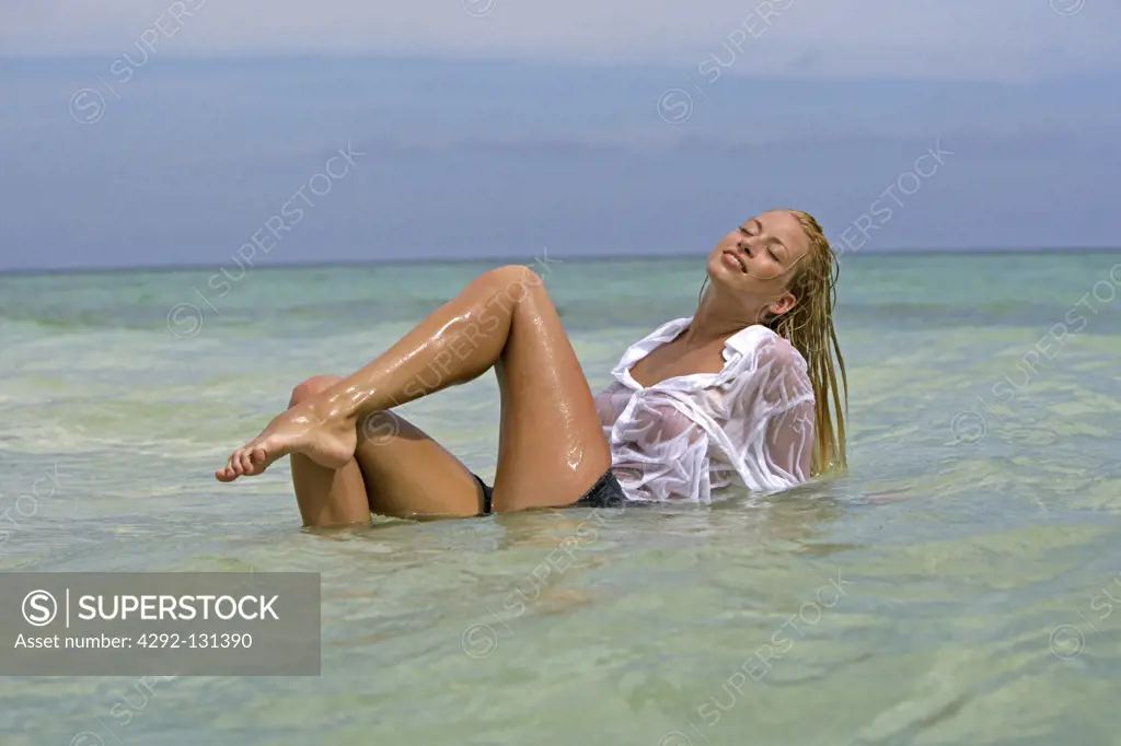sexy young blond woman enjoying holiday in portrait