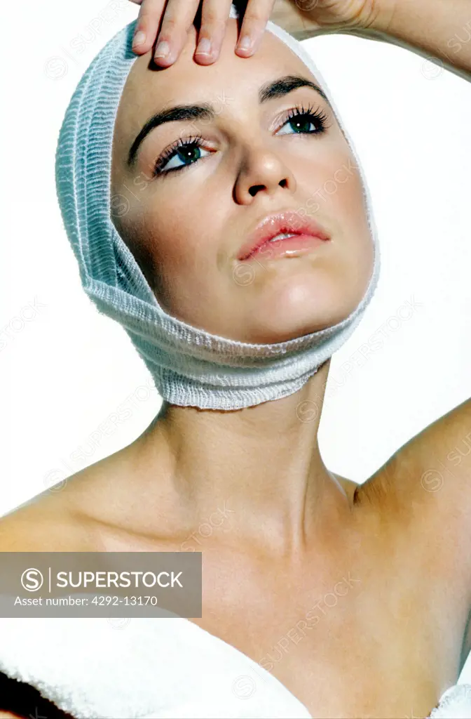 Woman with bandage around her head