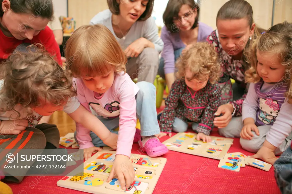 Kindergarden, mothers, women with playing children