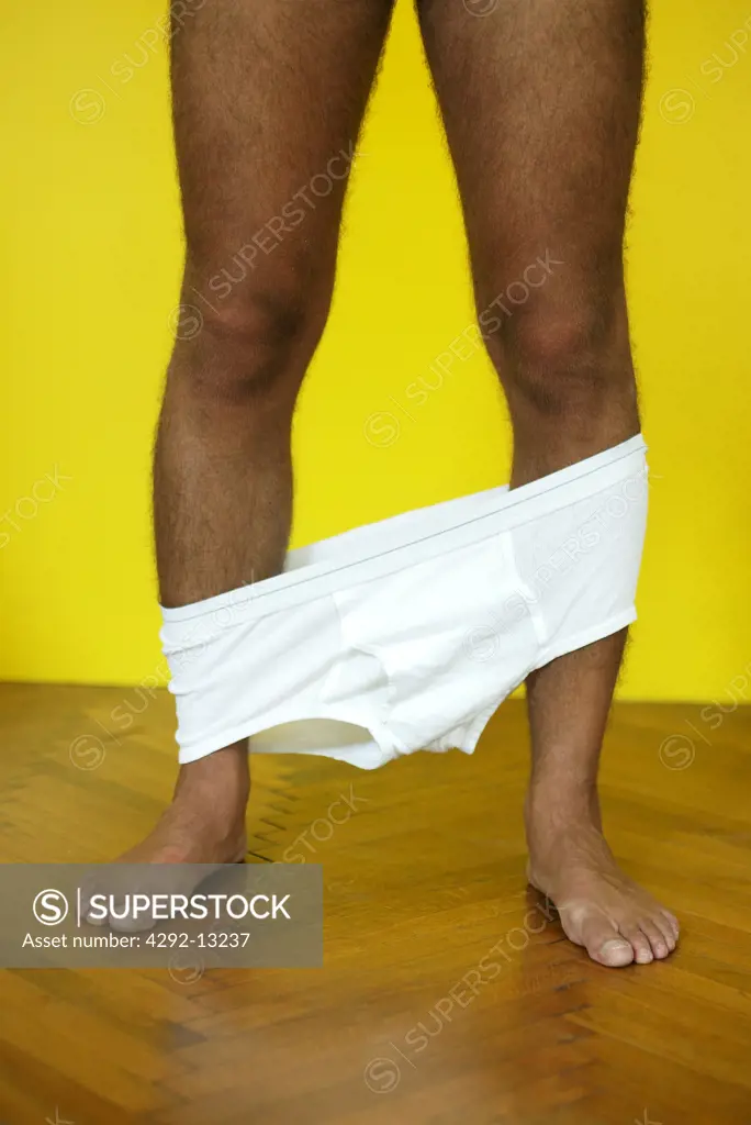 Man's legs with underpants down