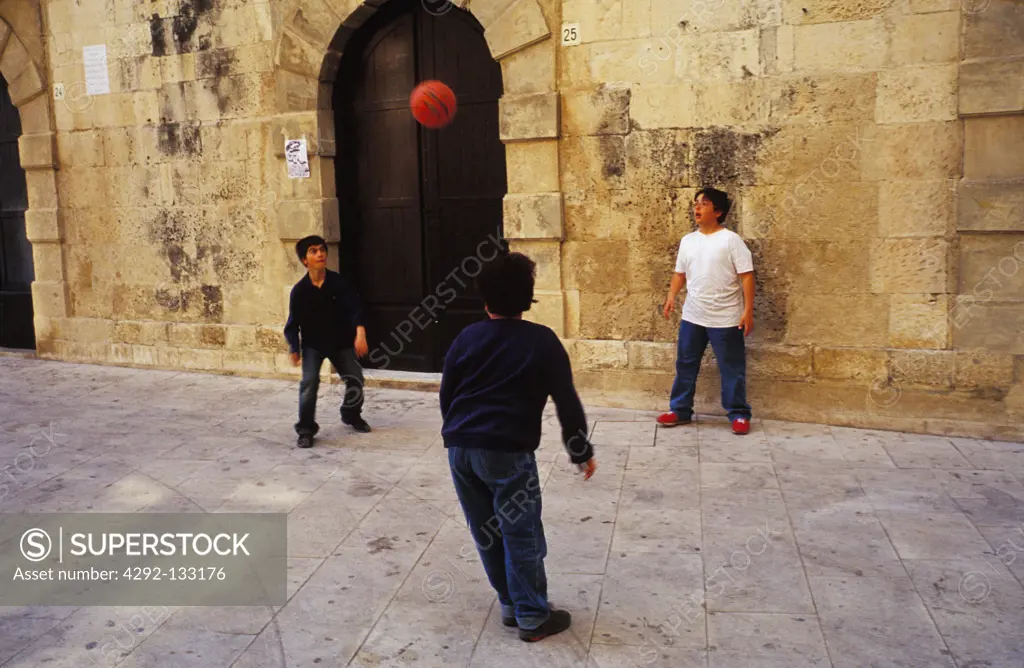 Playing Soccer in the Old City of Ortigia.