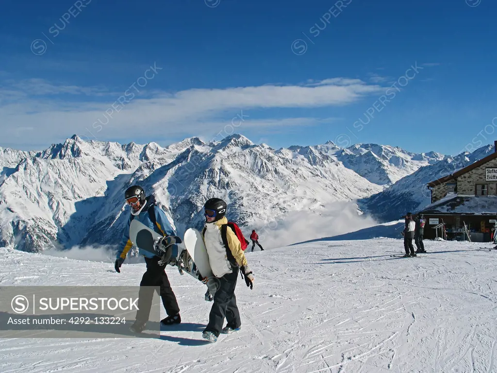 Snowboarders on a Mountain.