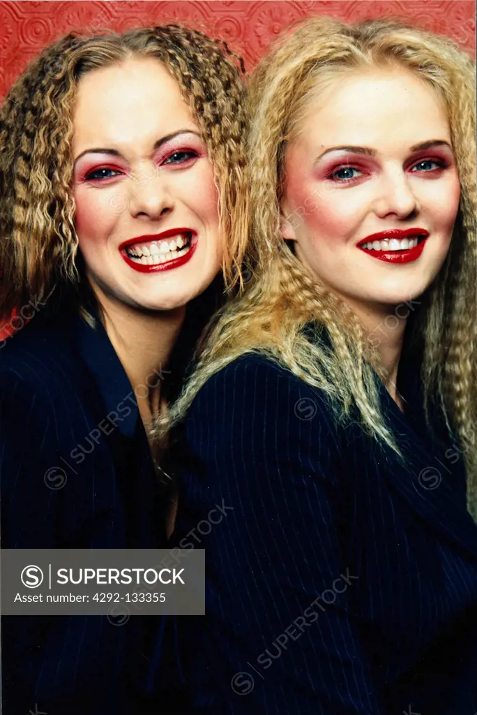 Two girls smiling.