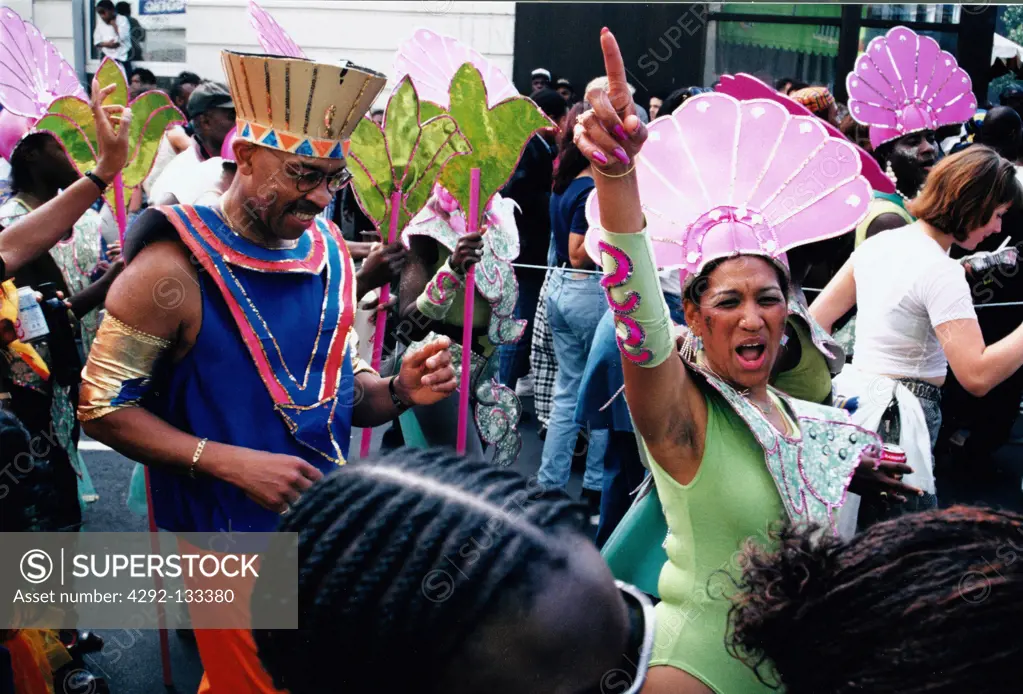 People in a carnival parade. The Notting Hill Carnival, the second largest street party in the world, has been taking place in London, on the last weekend in August, for the past thirty five year...