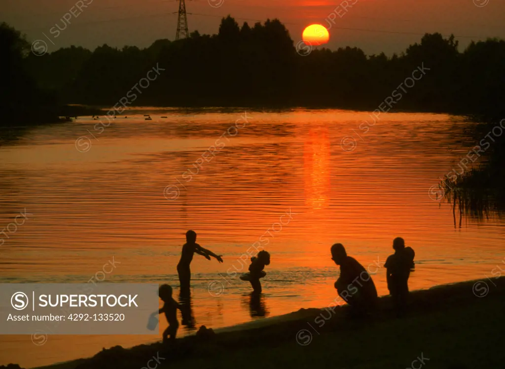 Children Swimming in the Evening.