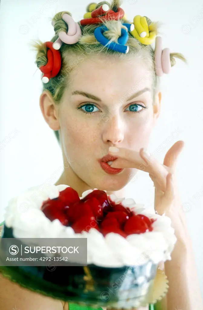 Woman portrait tasting cake