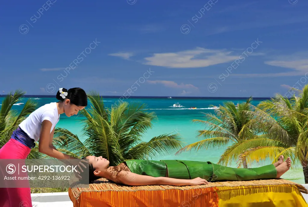 Asia, Philippines, Boracay, Mandala spa, woman getting a massage on the beach
