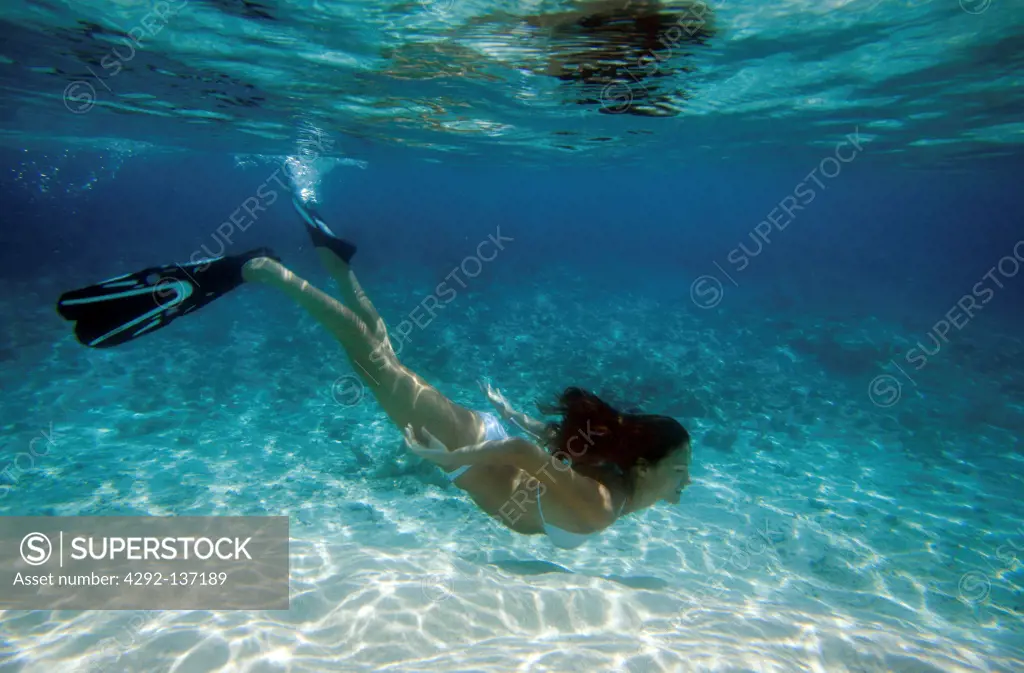 Woman snorkeling in Maldives, underwater view
