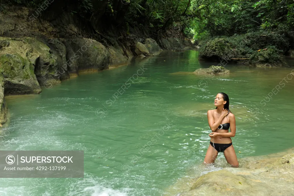 Asia, Philippines, Mag aso, woman in a pond