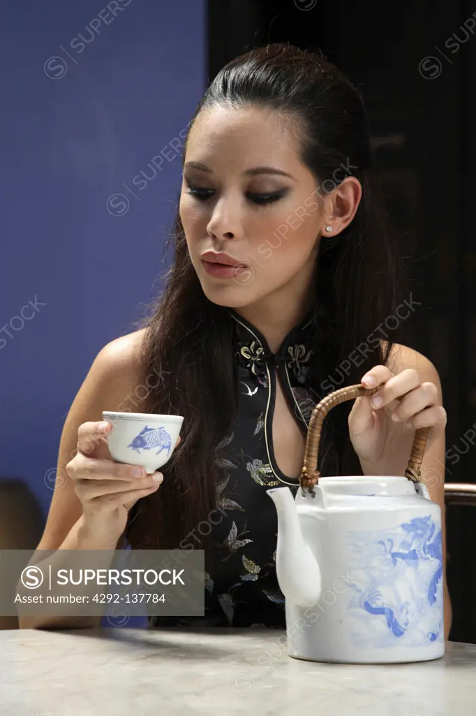 Chinese woman tasting tea