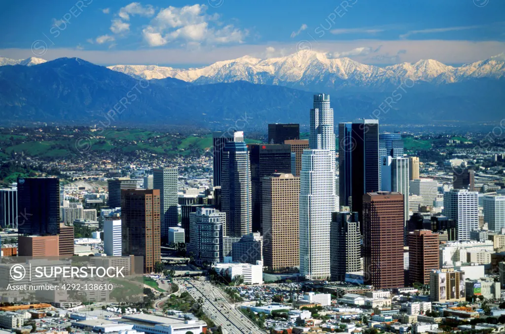 USA, California, aerial view of downtown Los Angeles, Civic Center with snow covered San Gabriel Mountains