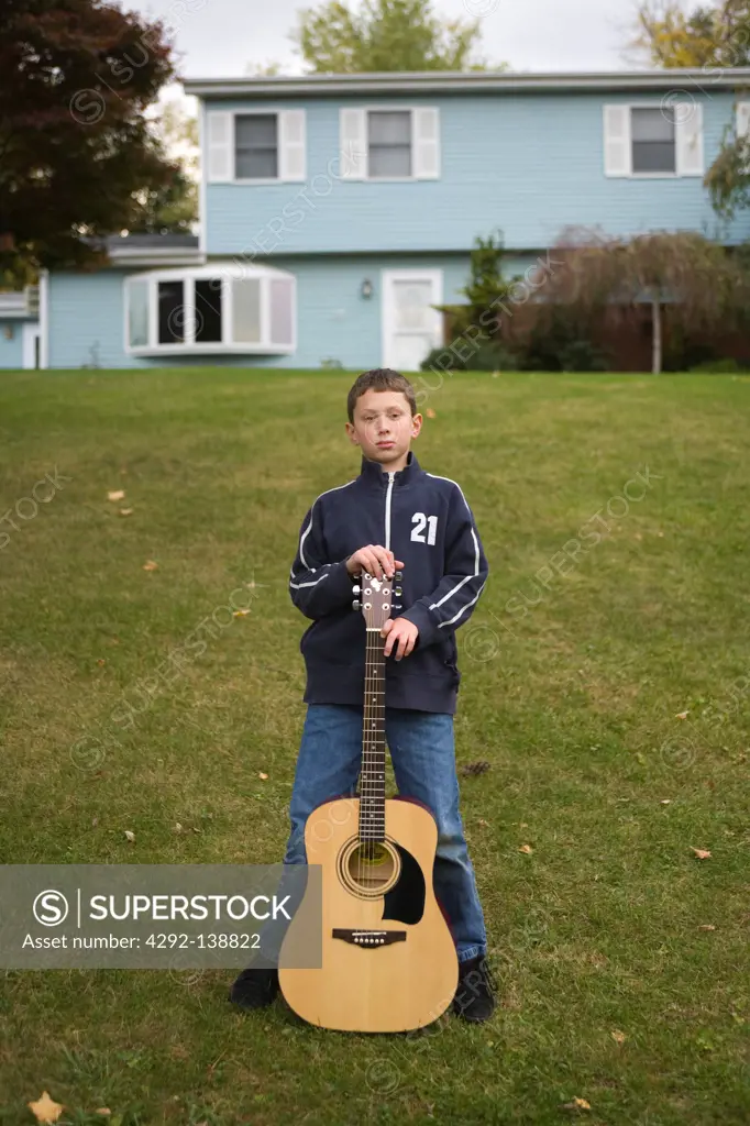 USA, Teenage boy with guitar