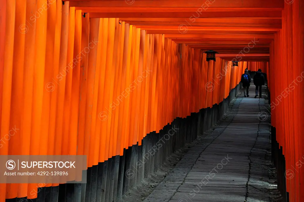 Kyoto, Japan, long line of Torii, traditional Japanese gate most commonly found at the entrance of or within a Shinto shrine, where it symbolically marks the transition from the profane to the sa...