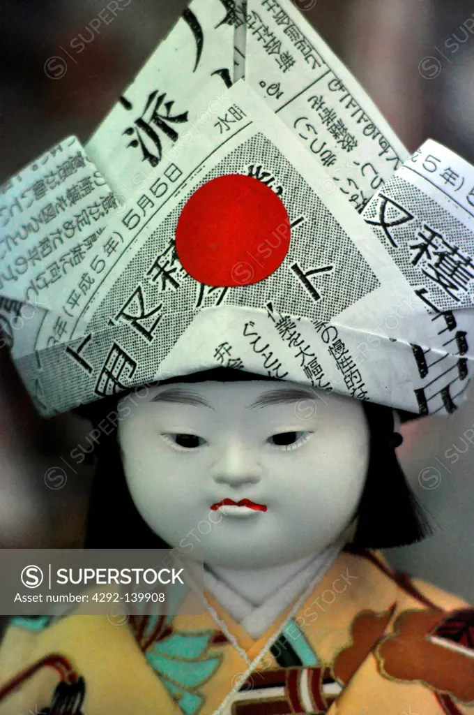 Kyoto, Japan, doll with a paper hat, sold in a shop